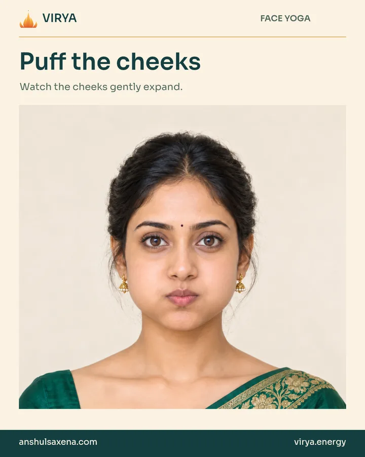 Fictional young adult Indian woman in an embroidered emerald silk saree demonstrates Puff the cheeks.