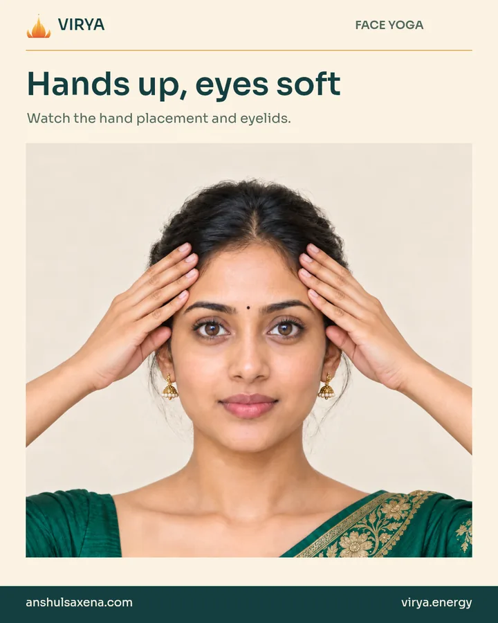 Fictional young adult Indian woman in an embroidered emerald silk saree demonstrates Hands up, eyes soft.